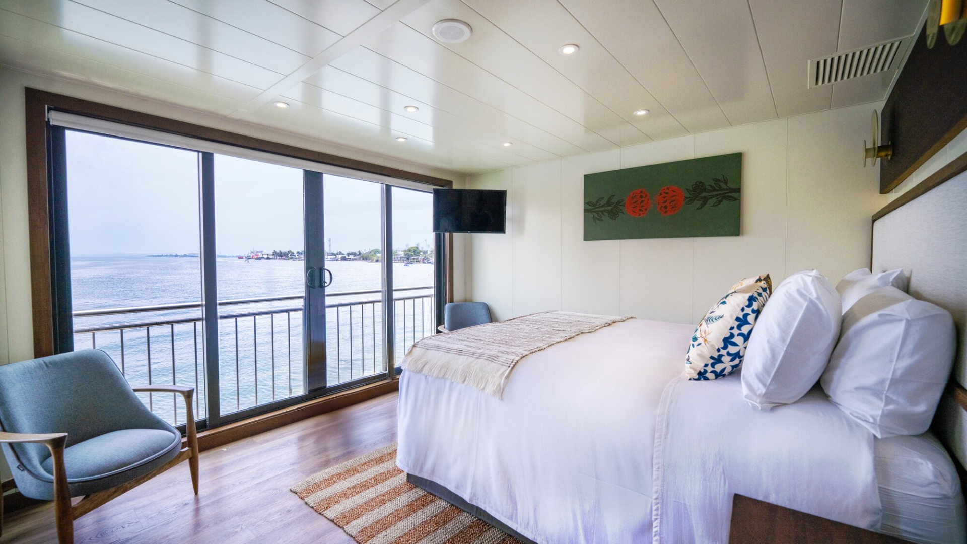 AMA Waterways stateroom with panoramic window and river view — luxury river cruise cabin