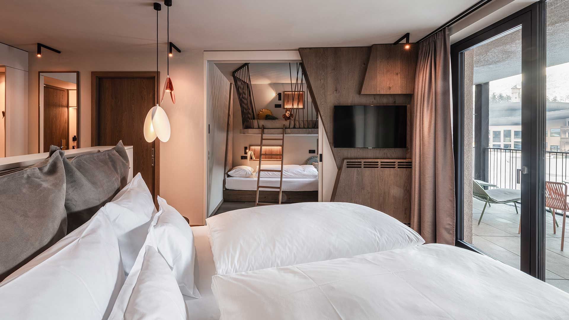 Premium Suite Falkynest bedroom with balcony at Falkensteiner Family Resort Lido