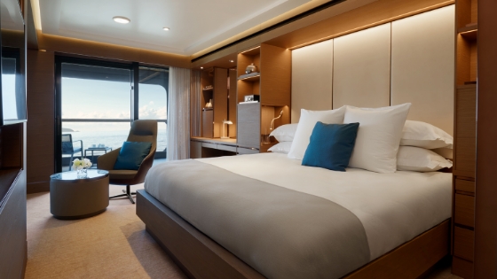 Terrace Suite bedroom interior on Evrima by Ritz-Carlton Yacht Collection showing private balcony ocean views
