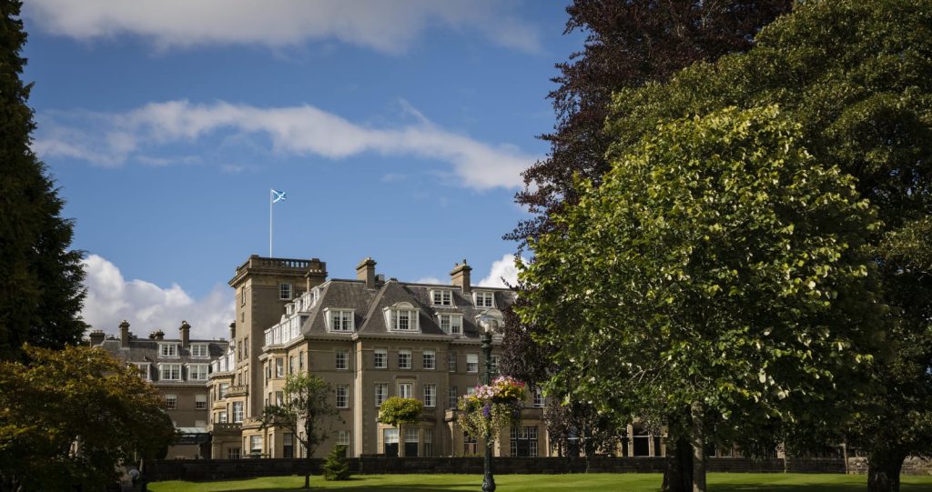 Exterior view of Gleneagles luxury estate in Perthshire Scotland with blue sky for corporate offsites